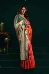 Woman wearing a traditional saree with a dark background
