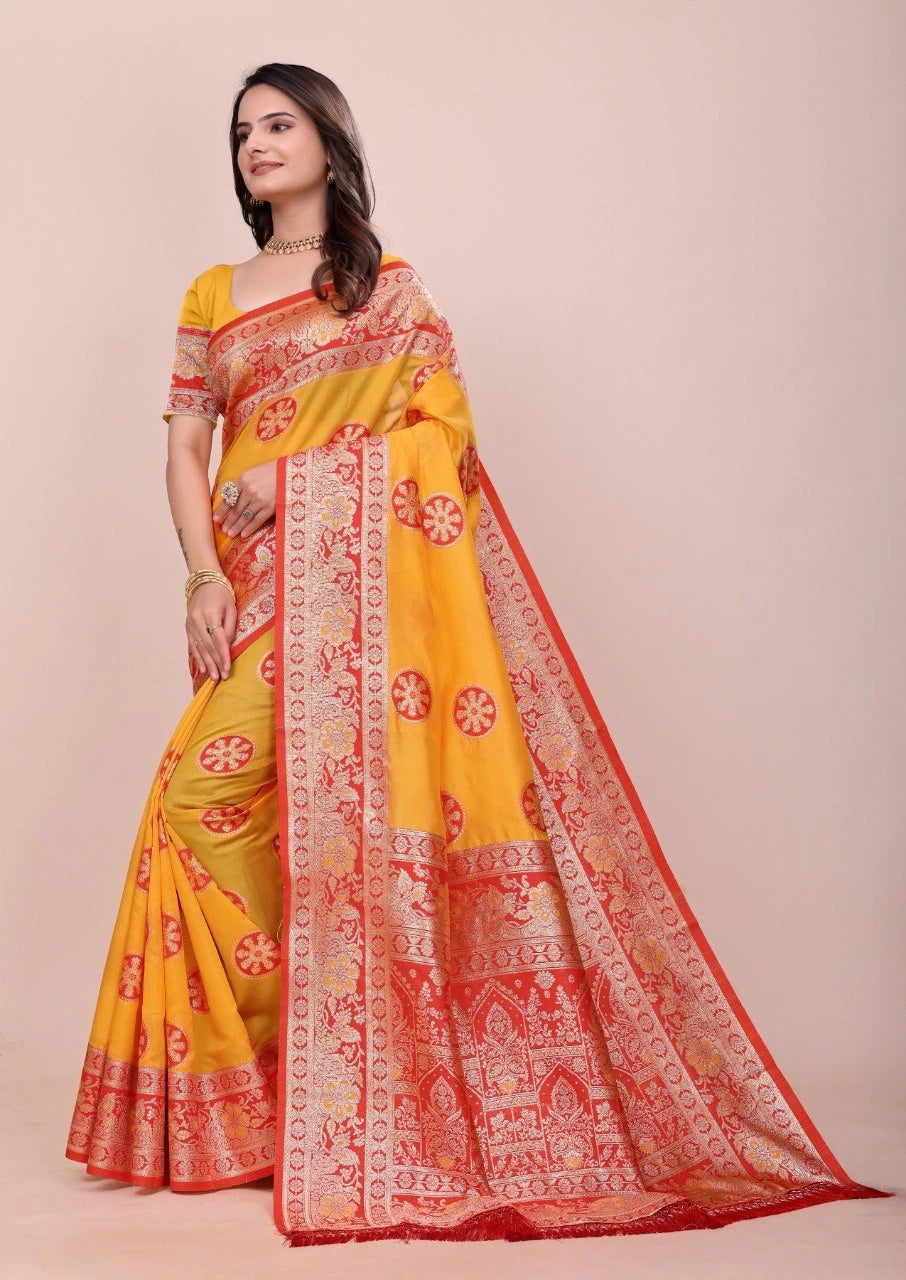 Woman wearing a yellow and red saree with a beige background