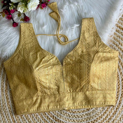 Elegant Pale Yellow Zari Work Silk Blouse featuring intricate embroidery, perfect for festive and traditional occasions.
