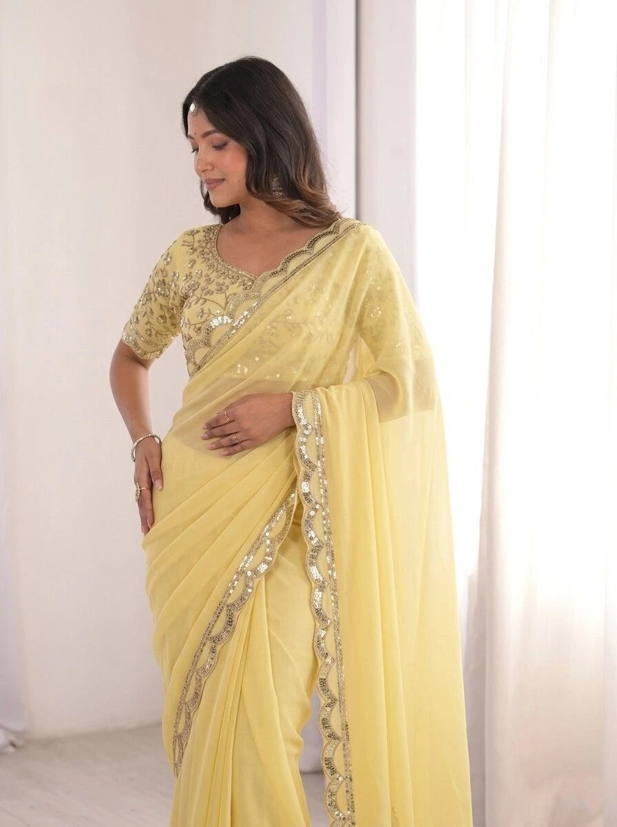 Woman wearing a light yellow saree with a white background