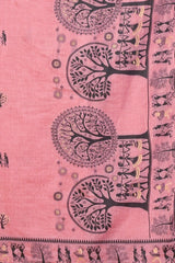 Pink fabric with black tree and figure patterns