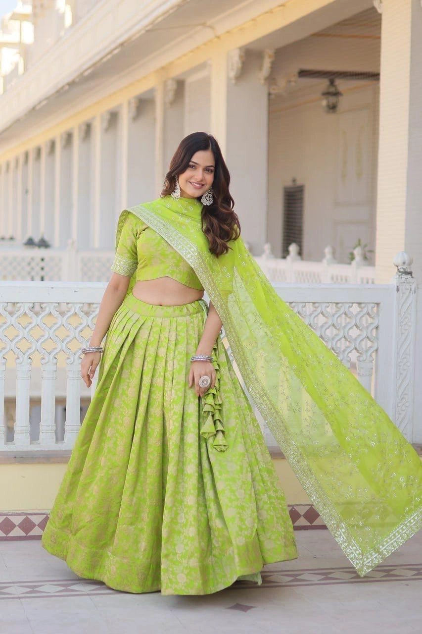 Woman in a green traditional outfit standing on a balcony