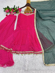 Flat lay of Pink Bandhej Print Suit on hanger with palazzo and green dupatta