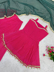Flat lay close-up of Pink Bandhej Print Suit top and green dupatta detail