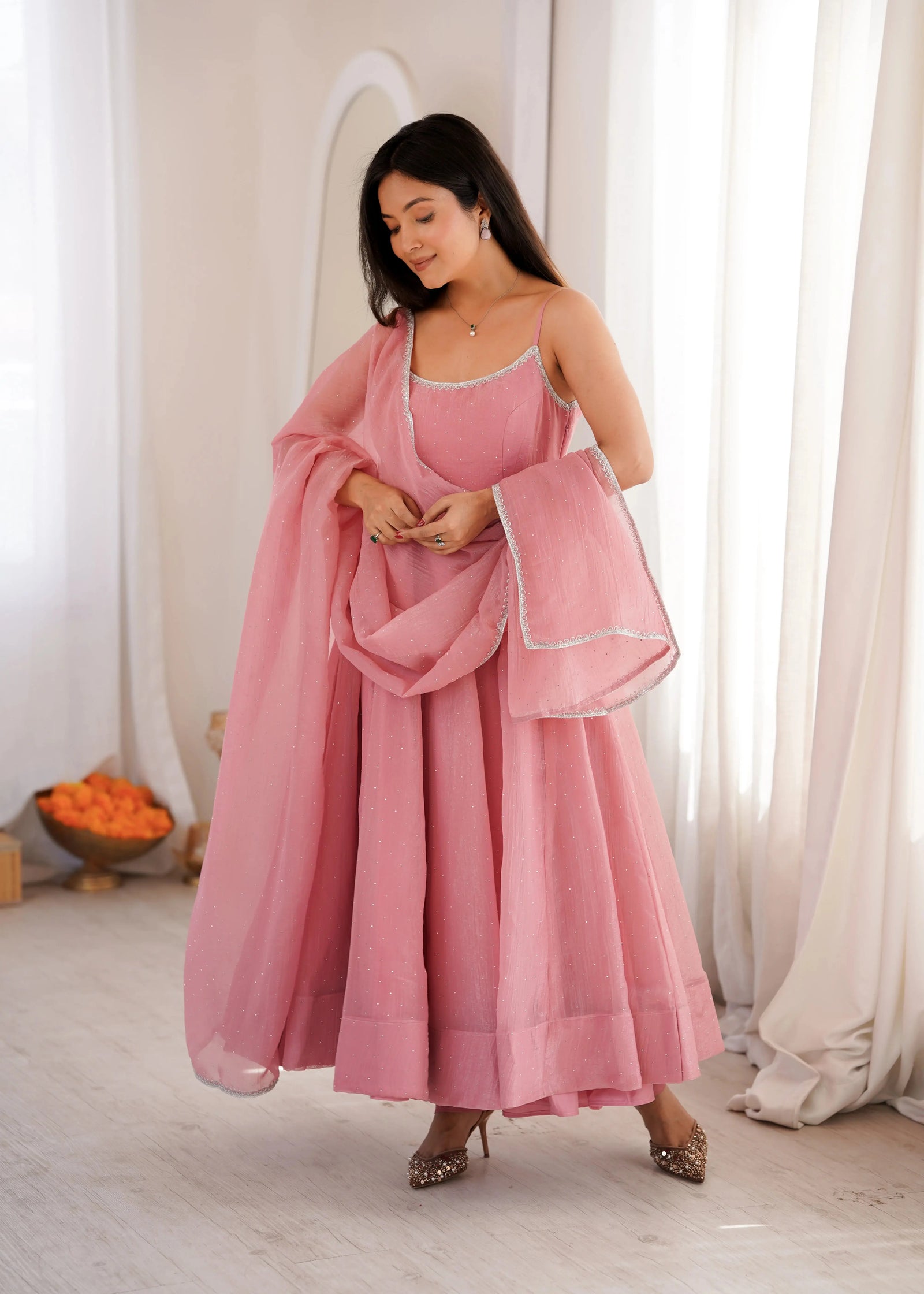 Pink Swarovski suit with lace-trimmed neckline, front view
