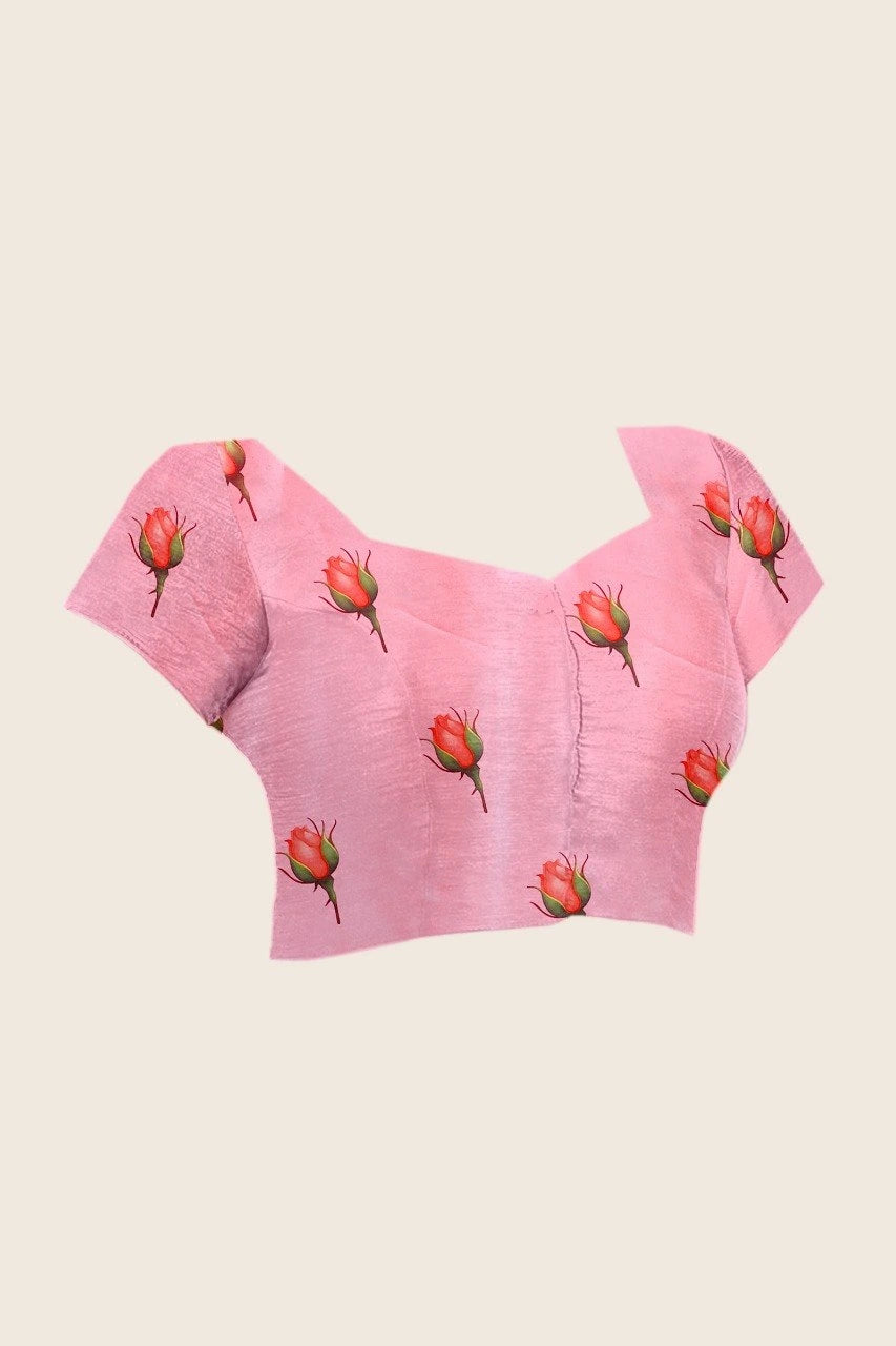 Pink crop top with floral patterns on a beige background