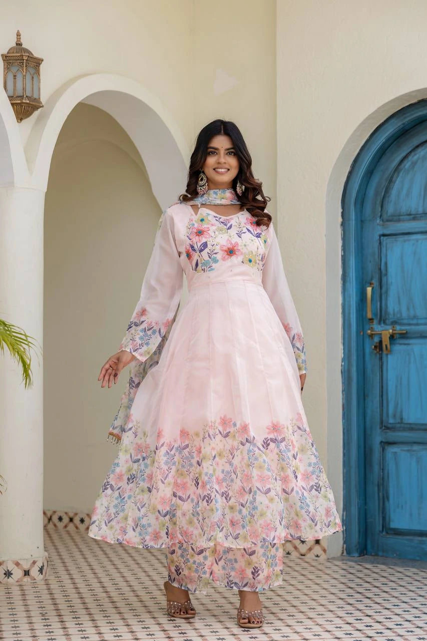 Stylish pastel pink floral ethnic gown with full sleeves and elegant traditional appeal.