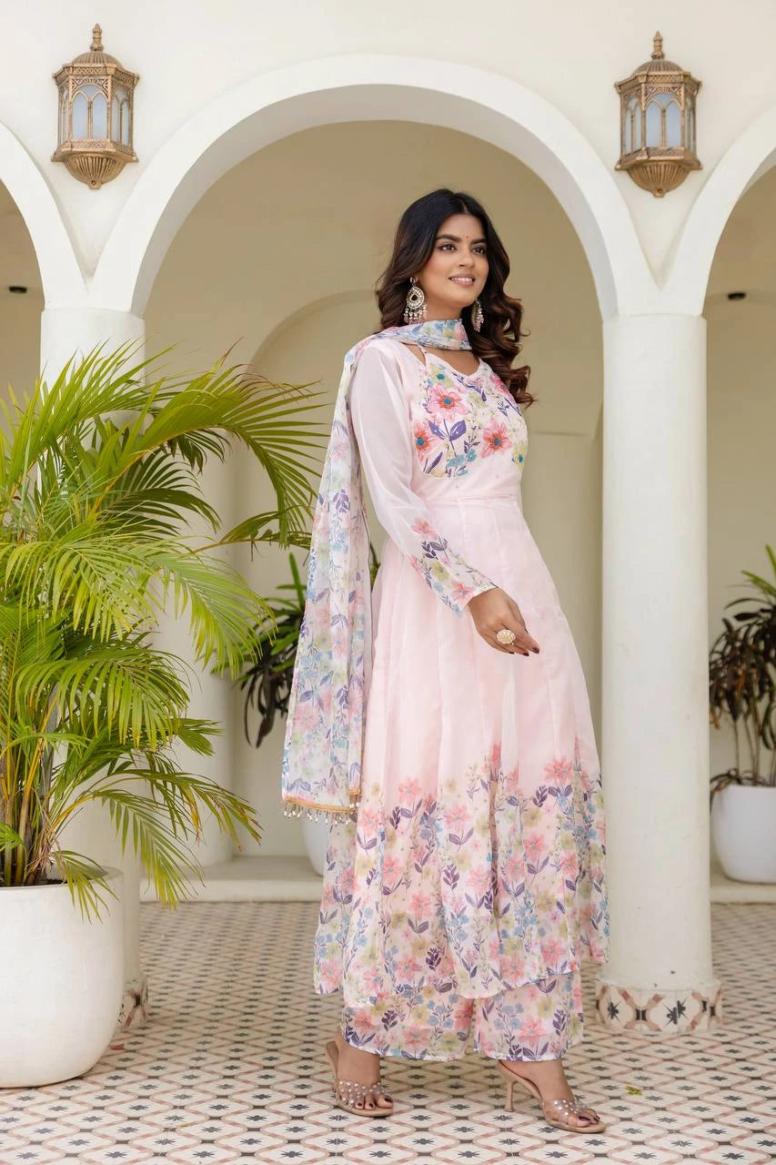 Graceful women's floral print long gown in soft pink with elegant full sleeve design.