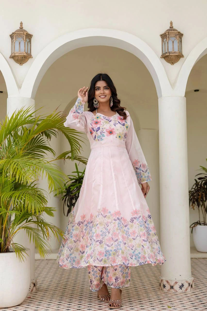 Women's designer floral Anarkali dress in soft pink with long sleeves and festive style.