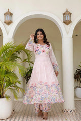 Women's designer floral Anarkali dress in soft pink with long sleeves and festive style.
