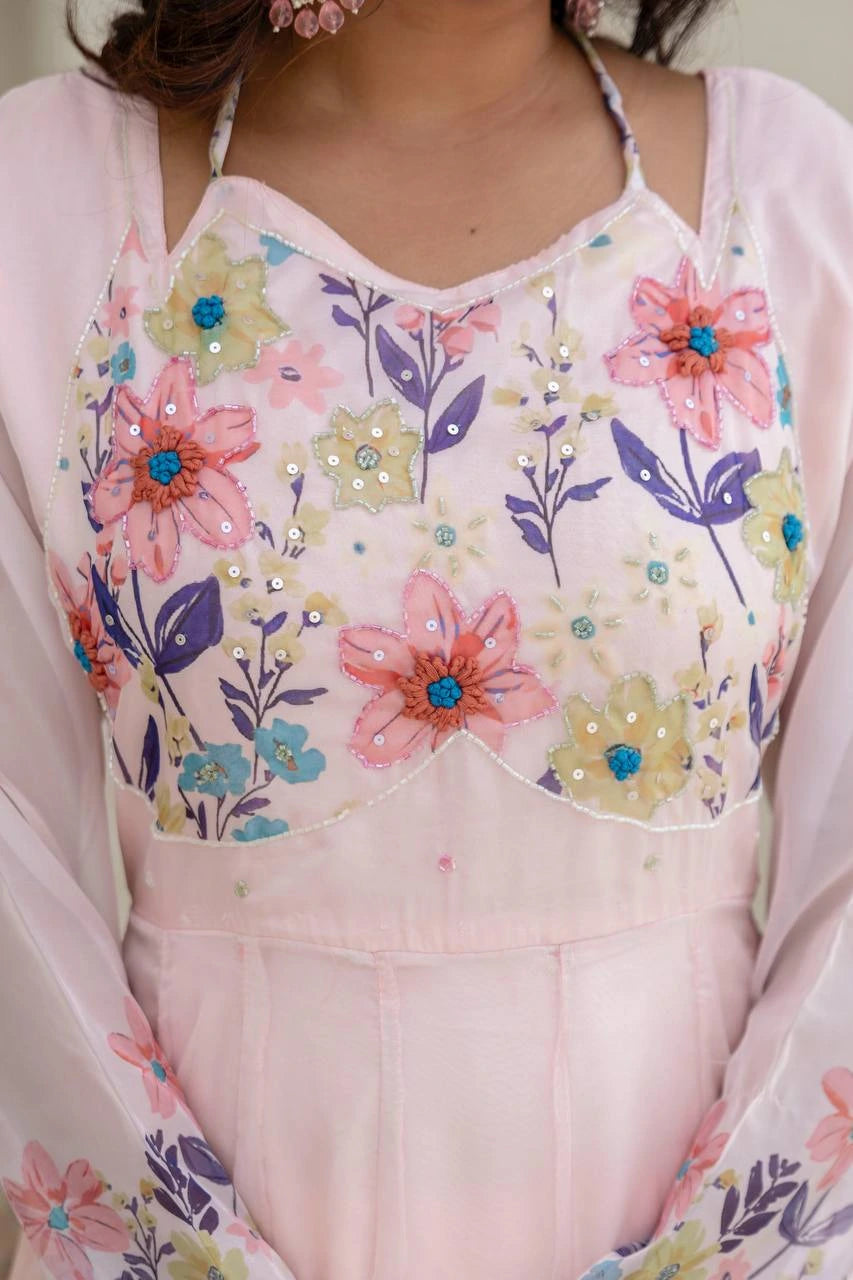 Charming light pink floral printed long ethnic gown for traditional events and special occasions.