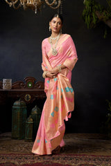 Woman in a pink saree with a dark background