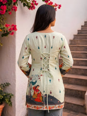 Back view of Pista Green Kalamkari Short Kurti showing criss-cross dori tie-up back detail and printed motifs