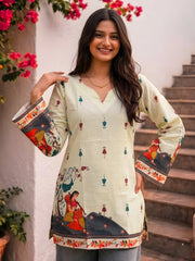 Pista Green Kalamkari Short Kurti front view with hands on hips showing full print pattern and bell sleeves