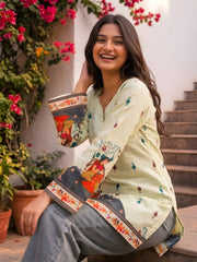 Model seated showing Pista Green Kalamkari Short Kurti sleeve detail with Rajasthani motifs on printed cuffs