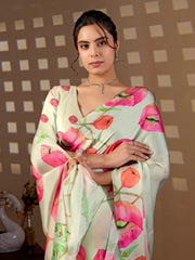Woman wearing a floral saree with a checkered wall background