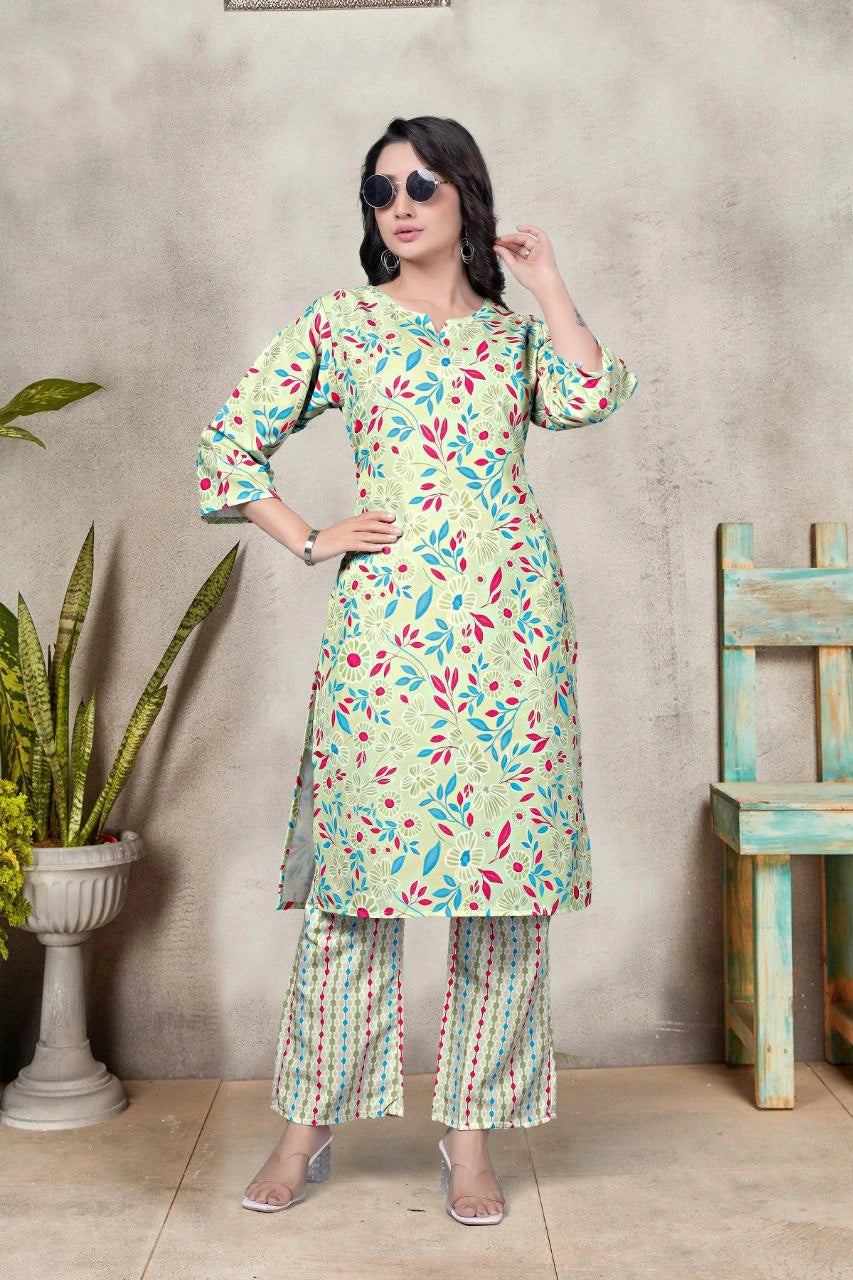 Woman wearing a floral kurta with palazzo pants against a neutral background