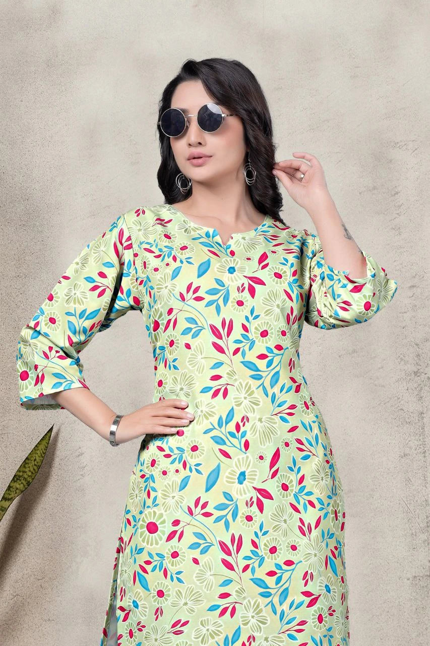 Woman wearing a colorful floral dress with sunglasses on a neutral background