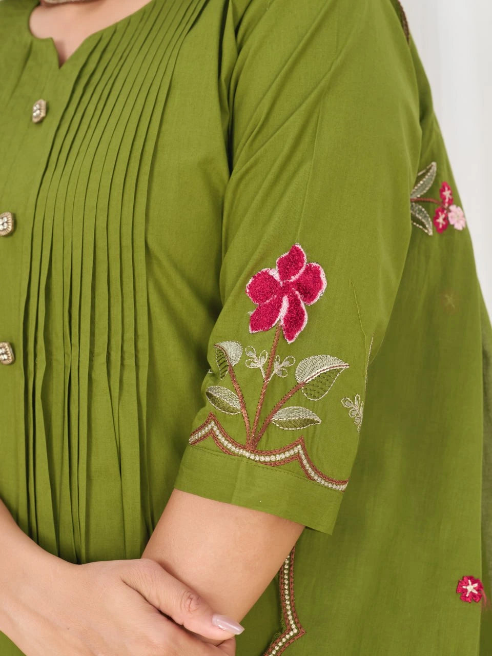 Green kurta with floral embroidery on a white background