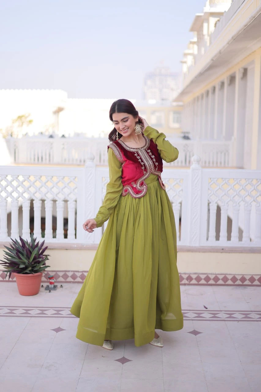 Woman in a green and red traditional outfit standing on a balcony.