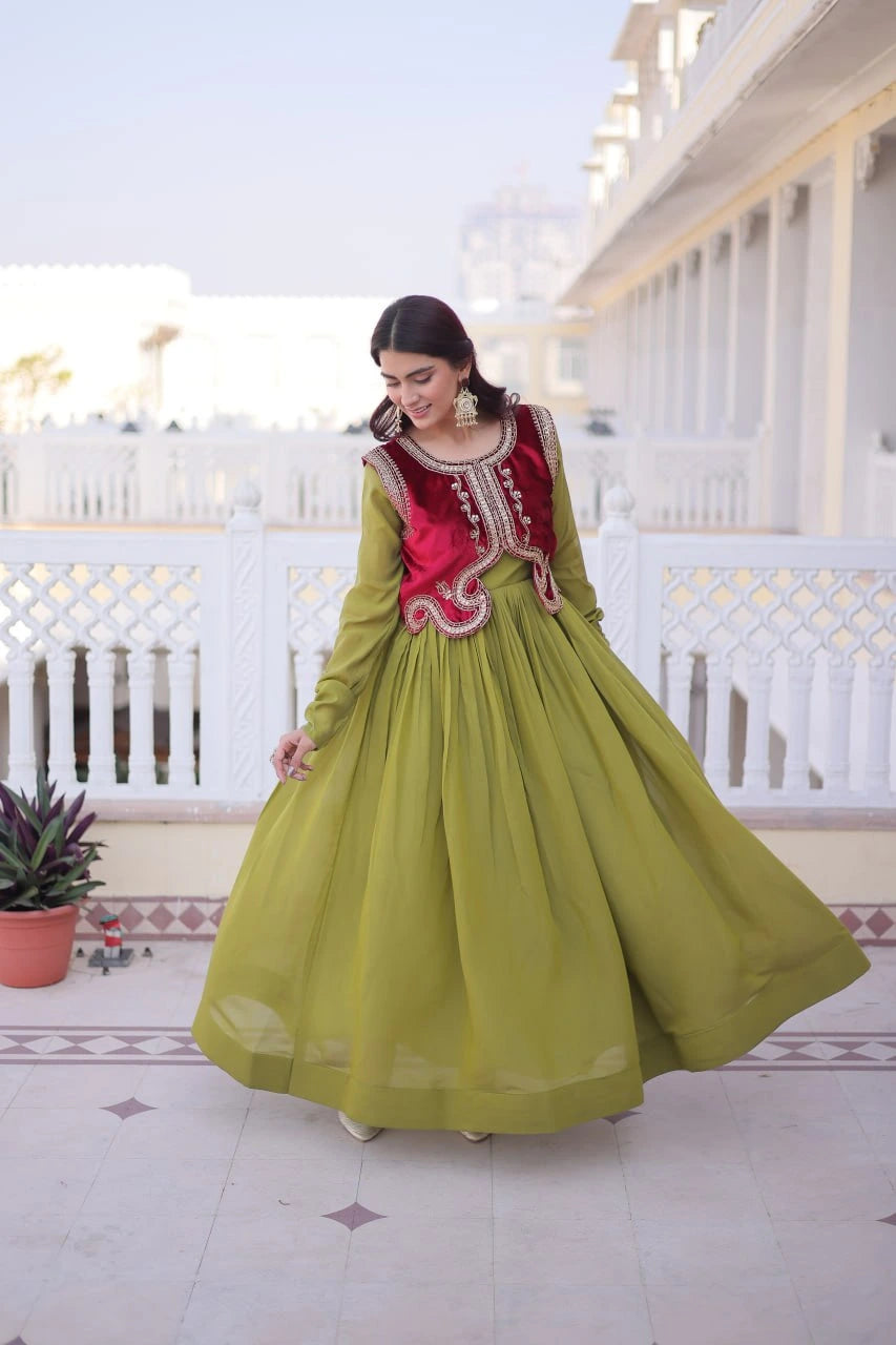 Woman in a green and red traditional outfit standing on a balcony.