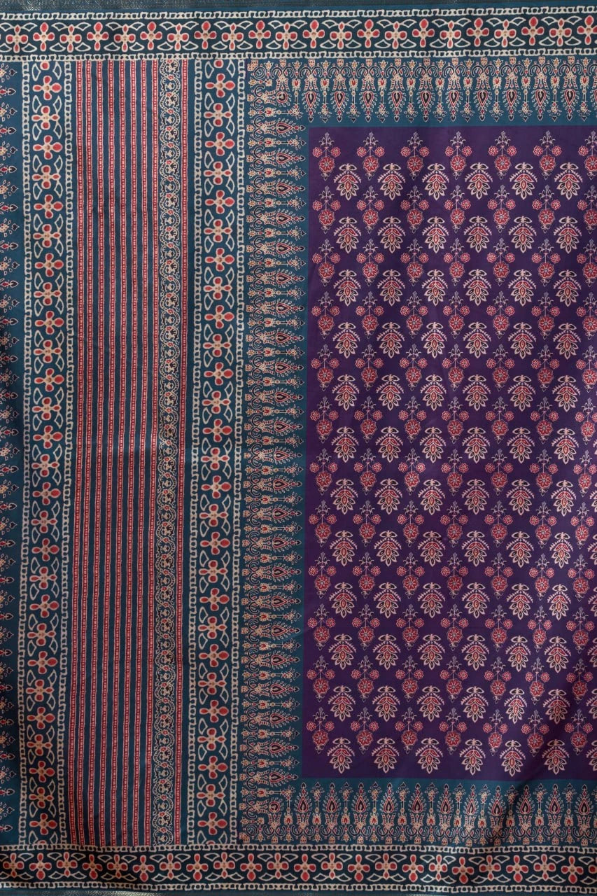 Decorative fabric with intricate patterns in purple and red