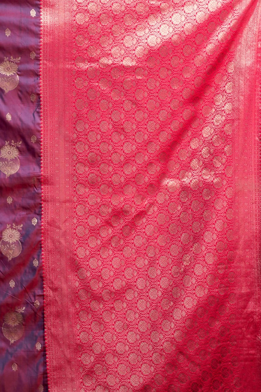Pink fabric with intricate patterns and a purple border