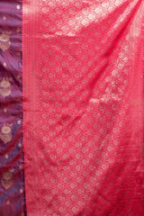 Pink fabric with intricate patterns and a purple border