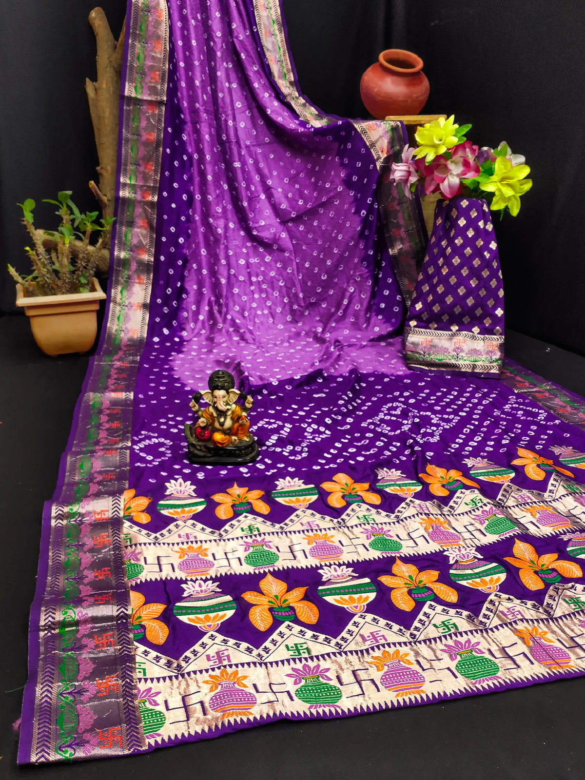 Purple saree with floral patterns on a black background