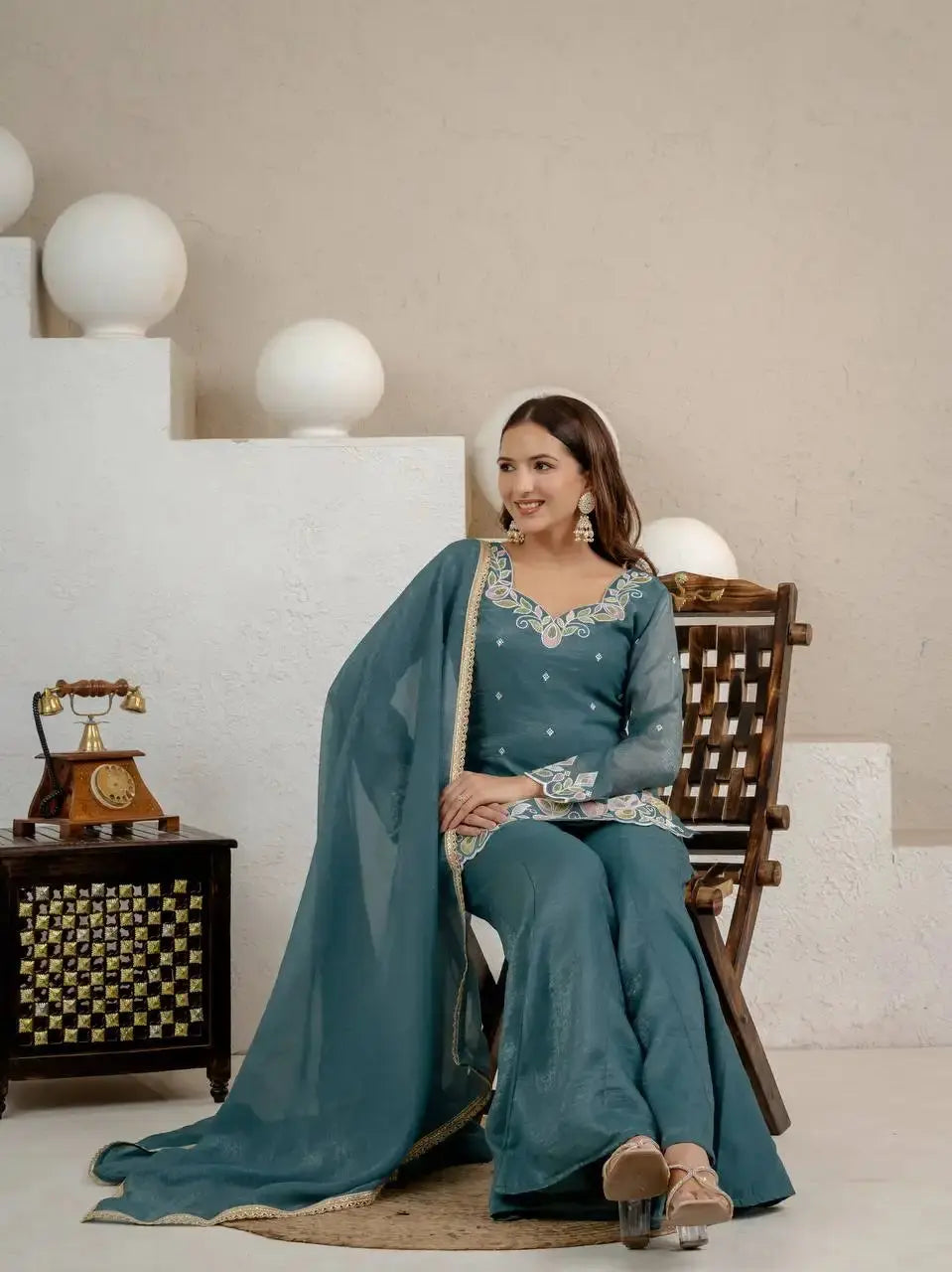 Rama Blue Sequins Embroidered Suit model seated pose with dupatta