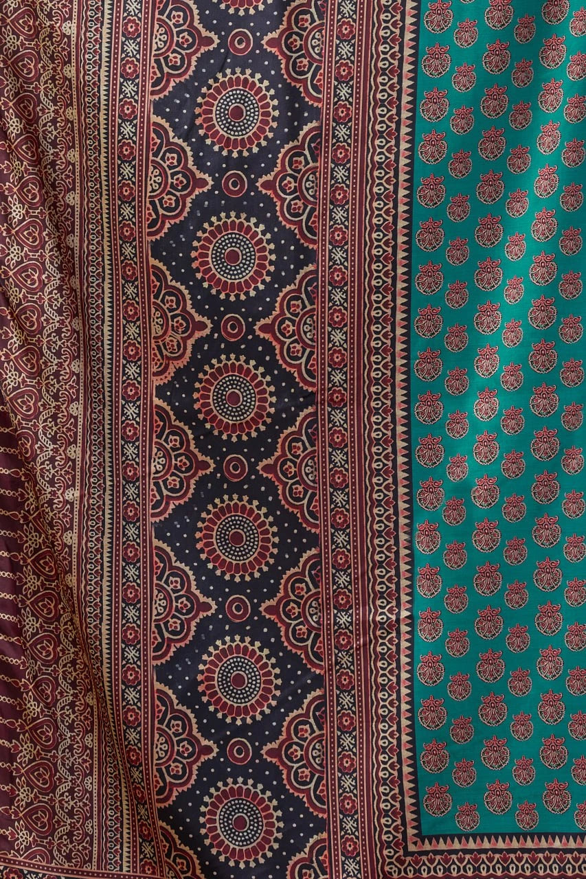 Patterned fabric with intricate designs in red, blue, and green.