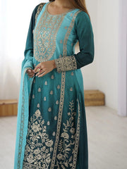 Teal embroidered traditional outfit with a white background