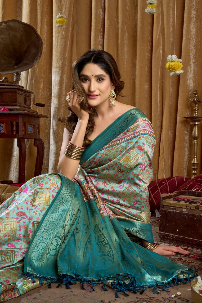 Woman in a teal saree with a vintage interior setting