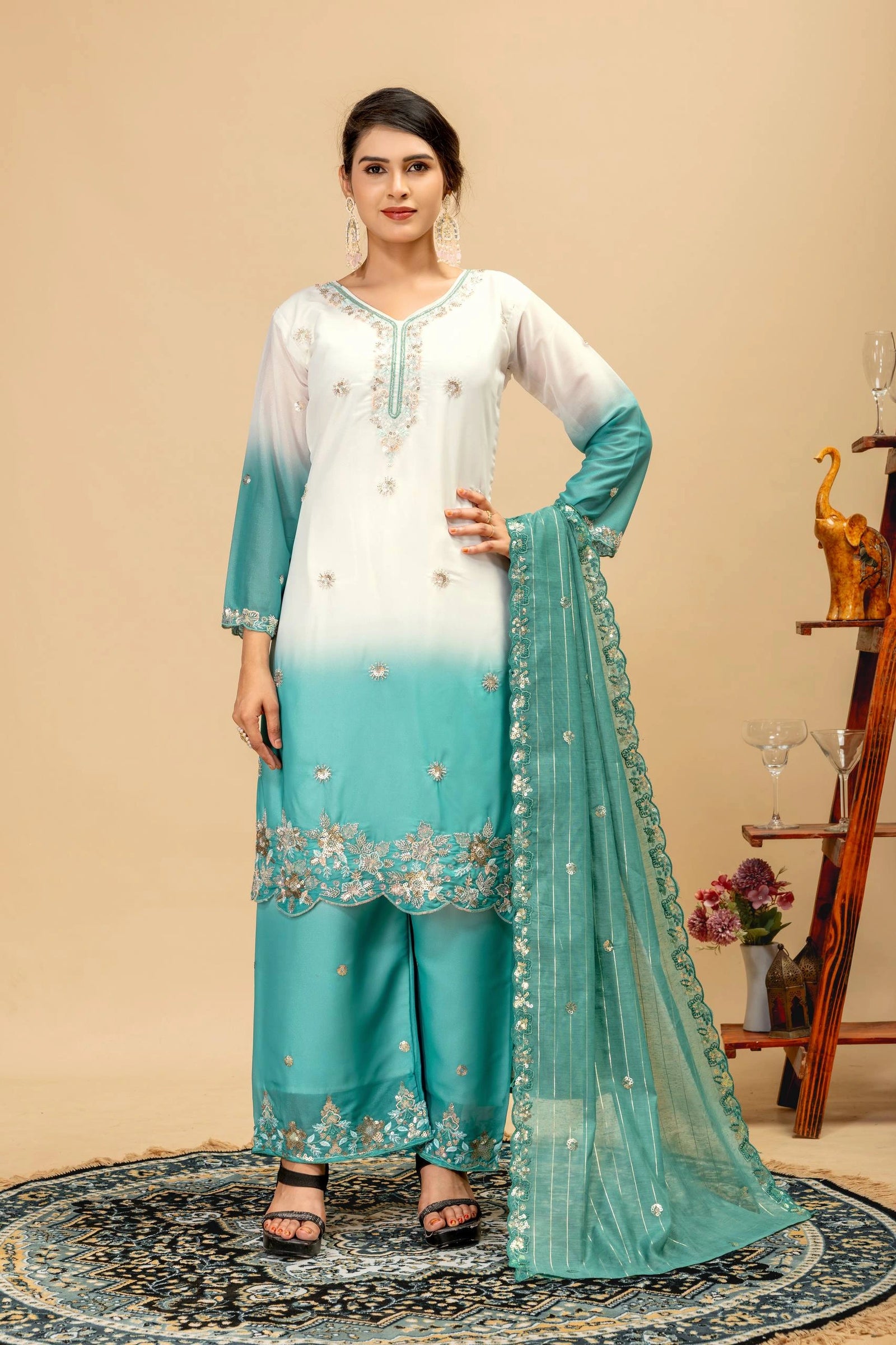 Woman wearing a white and blue embroidered outfit with a beige background