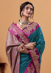 Woman wearing a traditional saree with a pink and blue color scheme on a beige background