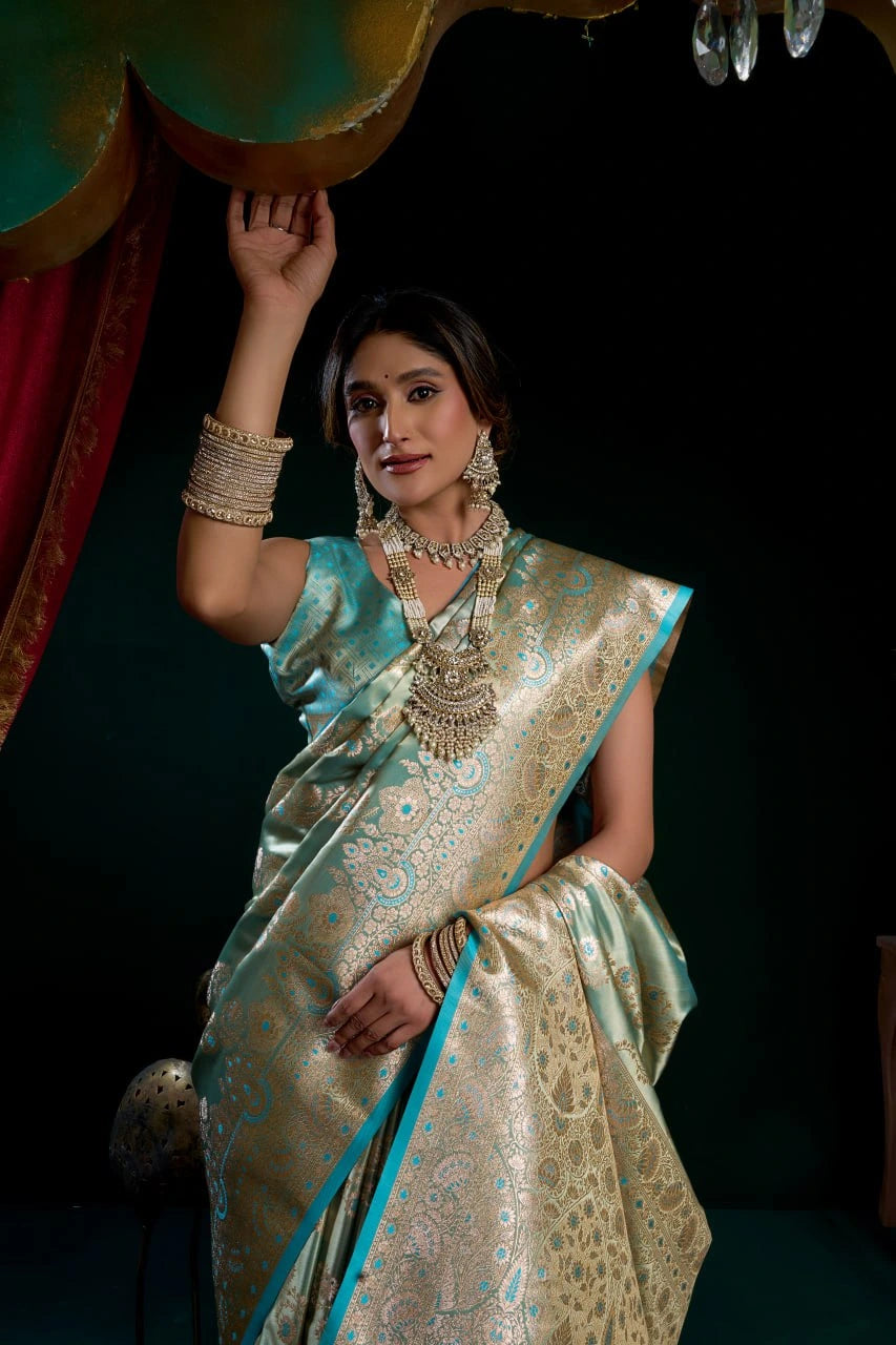 Woman in a traditional saree with jewelry against a dark background