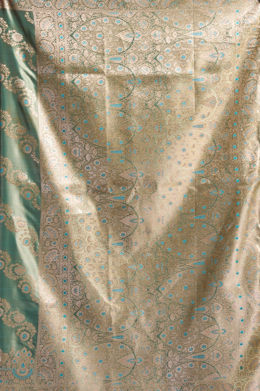 Patterned fabric with a mix of green and beige colors