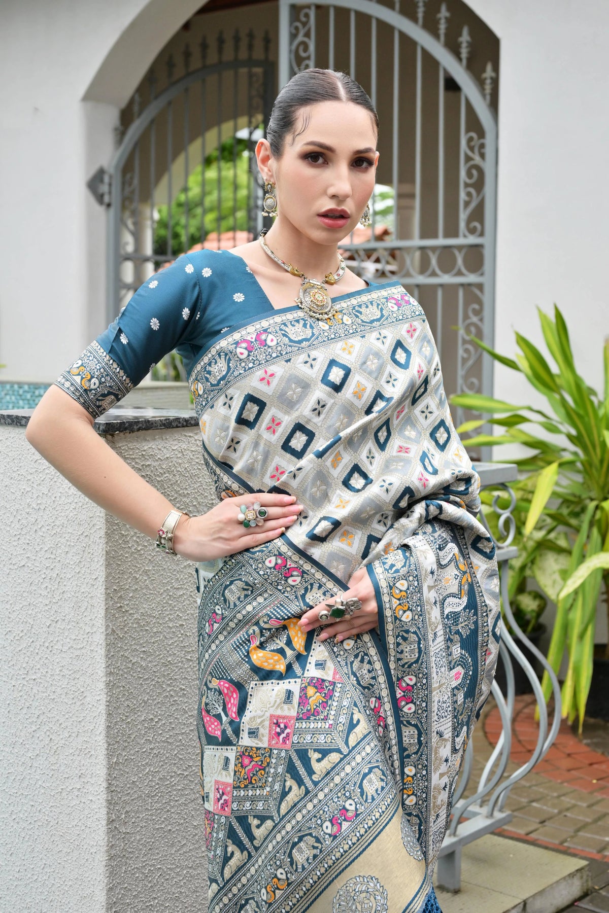 Elegant soft Banarasi silk saree in rich blue shade featuring intricate zari border and pallu.