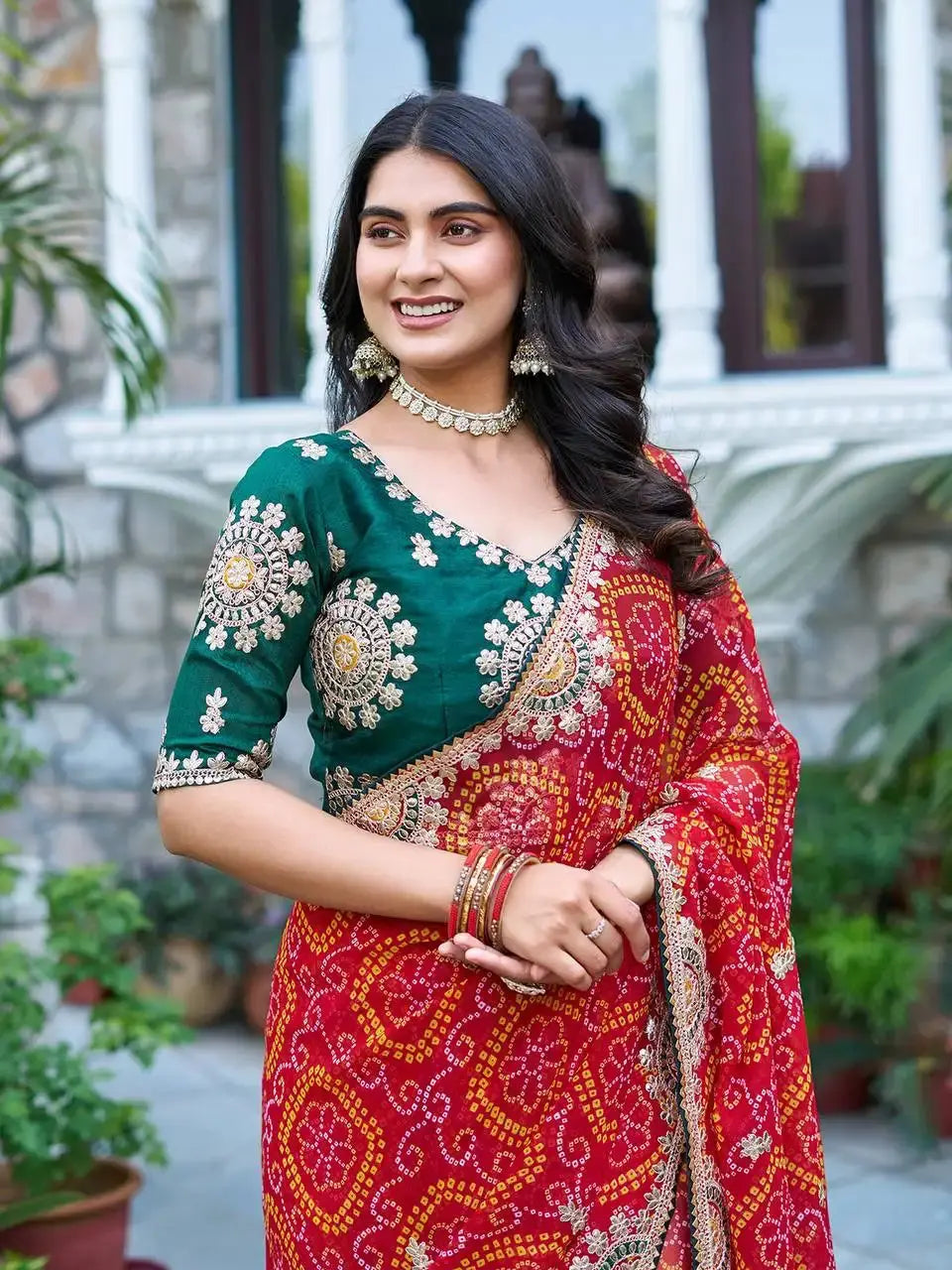 Close-up of green Mono Silk blouse with gota patti embroidery on Red Gota Patti Saree