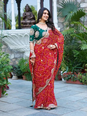 Model wearing Red Gota Patti Saree with green Mono Silk blouse, front pose
