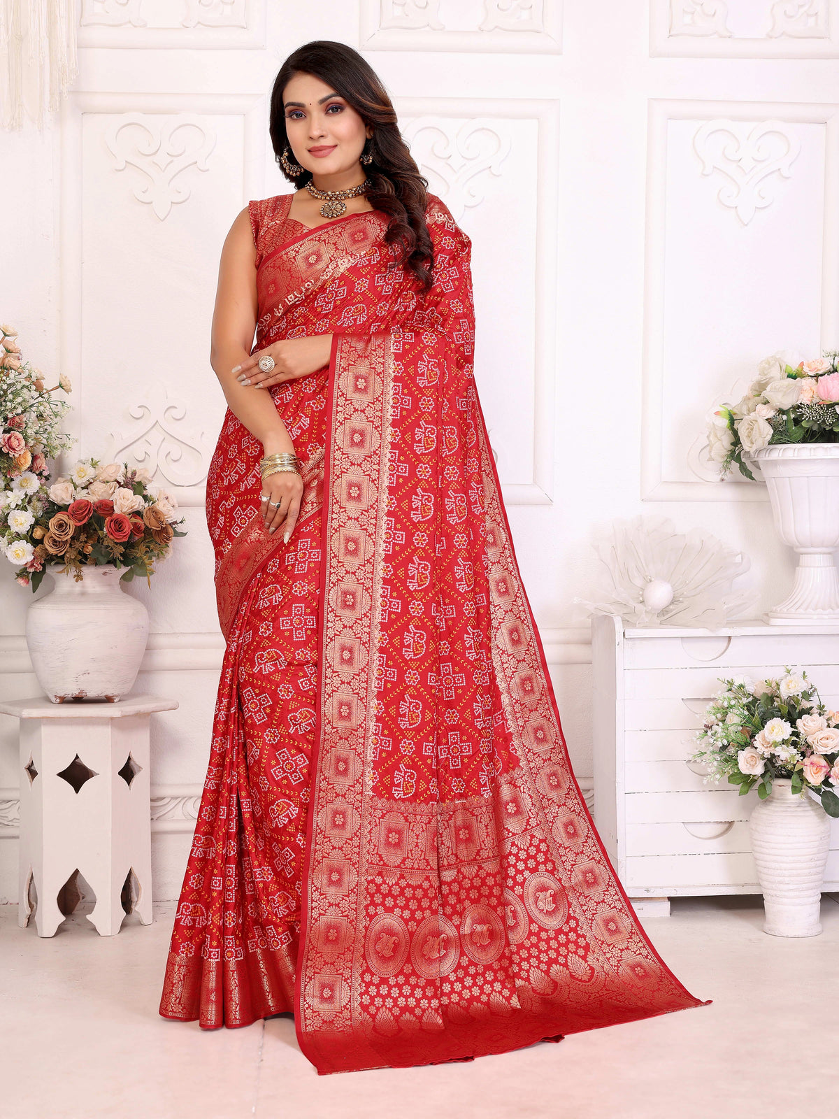 Woman wearing a red saree with a white background
