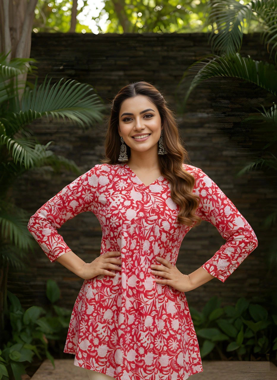 Red cotton short kurti with vibrant digital floral print, round neckline, and 3/4th sleeves — stylish casual wear for everyday comfort