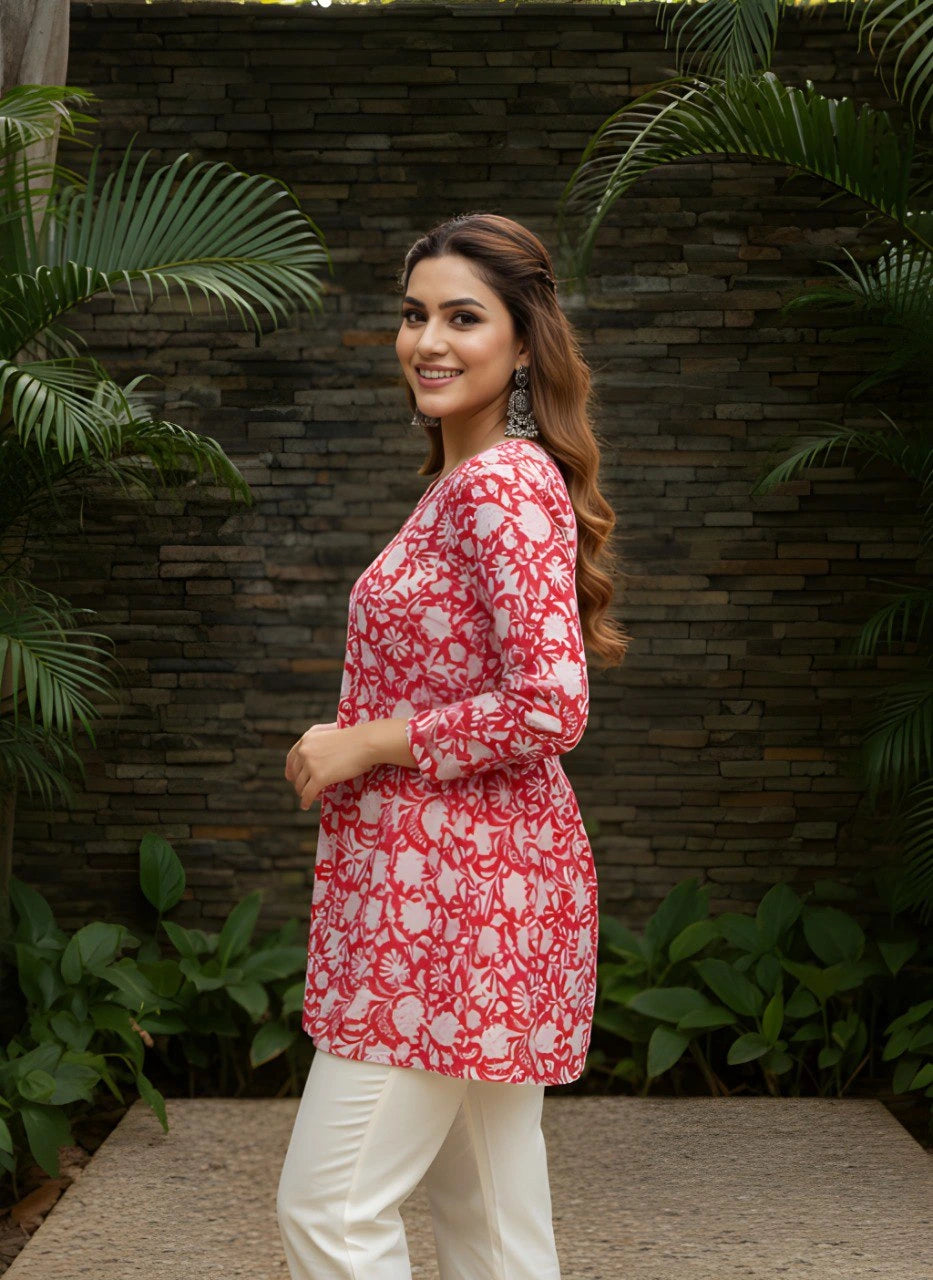 Red cotton short kurti with vibrant digital floral print, round neckline, and 3/4th sleeves — stylish casual wear for everyday comfort