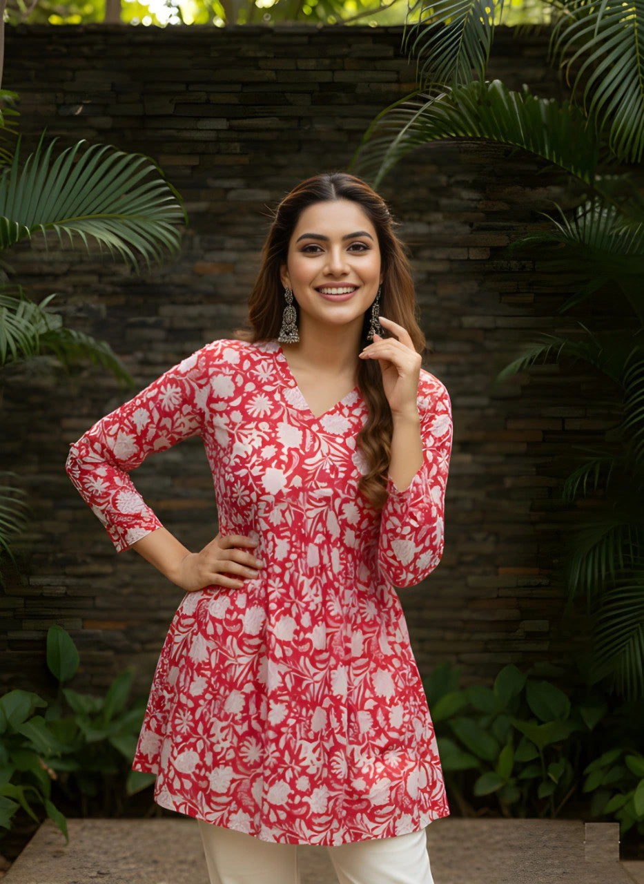 Red cotton short kurti with vibrant digital floral print, round neckline, and 3/4th sleeves — stylish casual wear for everyday comfort