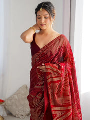 Woman wearing a red saree with a white background