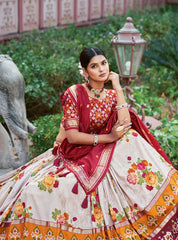 Woman in a traditional saree with floral patterns in a garden setting