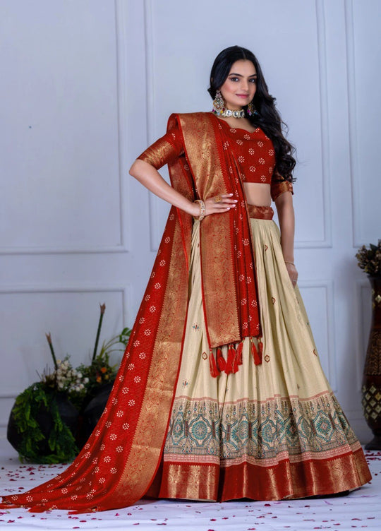 Woman wearing a traditional red and beige saree with a white background