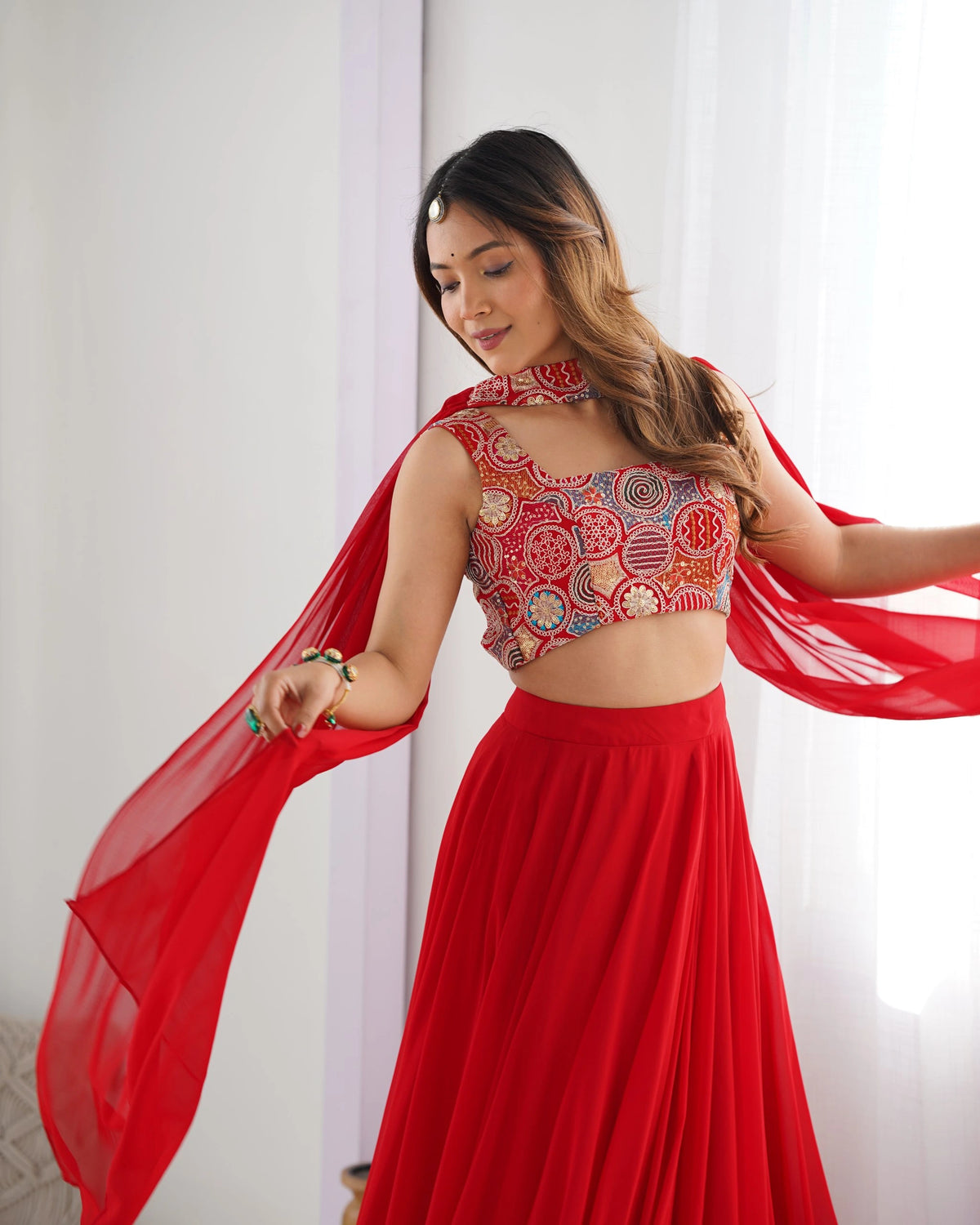 Woman in a red traditional outfit with a white background