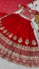 Red embroidered traditional outfit with gold details on a light gray background