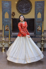 Woman in a red top and white skirt standing in a decorated room with candles and decorative elements.